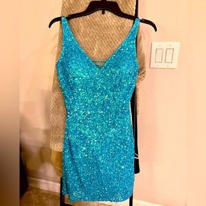 Turquoise sequin Homecoming dress. Purchased at Nikkis Glitz and Glam boutique.
